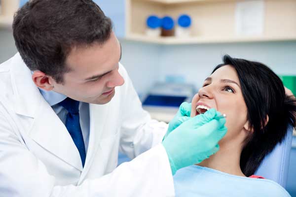 Patient With Dentist in Dental